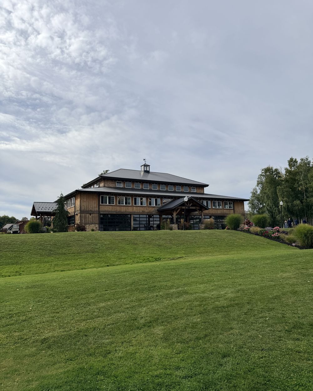 The timber event building at Colloca Estate Winery seen from the lawn below
