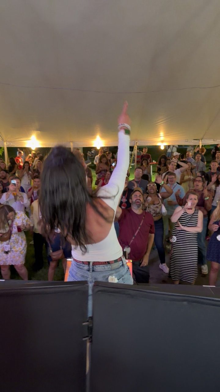DJ Steven Share hosting a karaoke tent at a Cornell alumni event