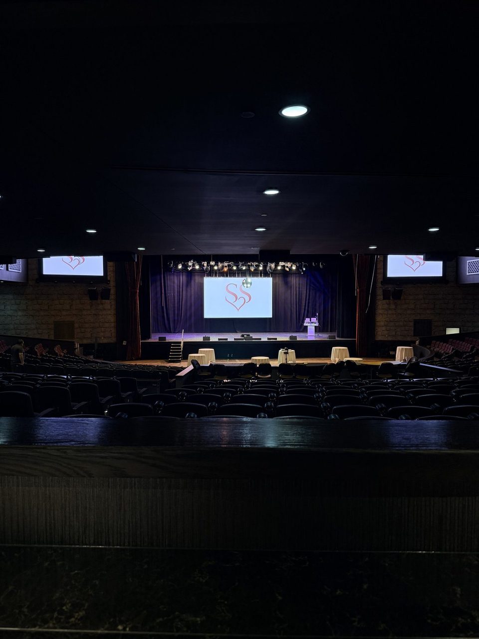 DJ Steven Share branded stage production in a full theater venue